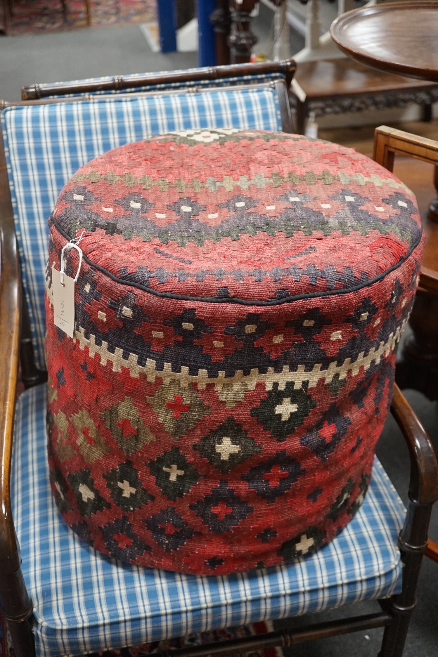 A circular kilim pouffe, diameter 45cm, height 40cm